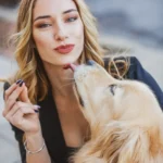 Dog licking owner's face — why does my dog lick me so much?