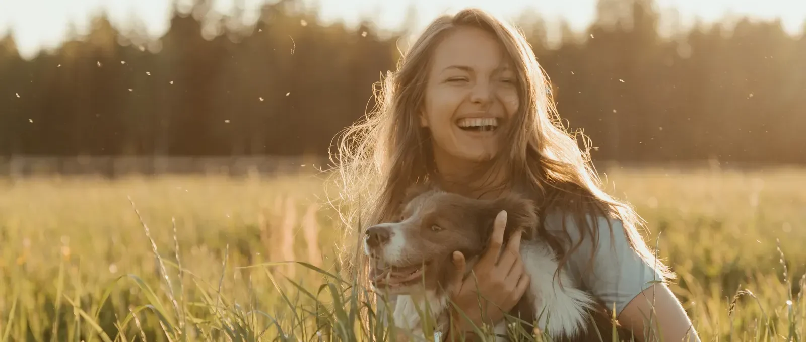 Happy owner with their dog — 5 reasons a dog improves your quality of life