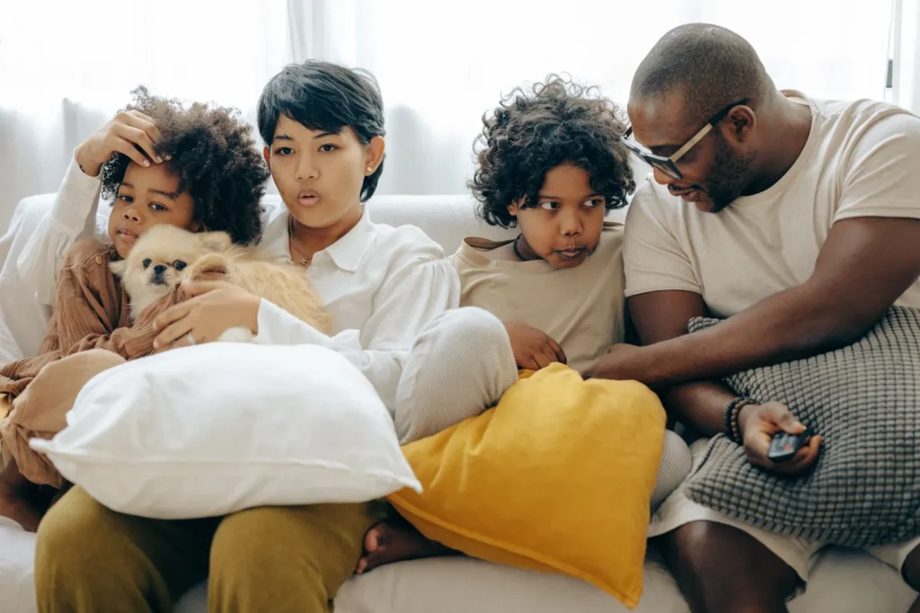 Do You Need Separate Policies for Each Pet? Multi-Pet Rules Explained (2026) 13 Family relaxing with their dog — MetLife's Family Plan is the one exception to separate pet insurance policies