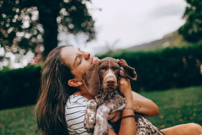 Happy new owner with a puppy — best dog breeds for first-time owners