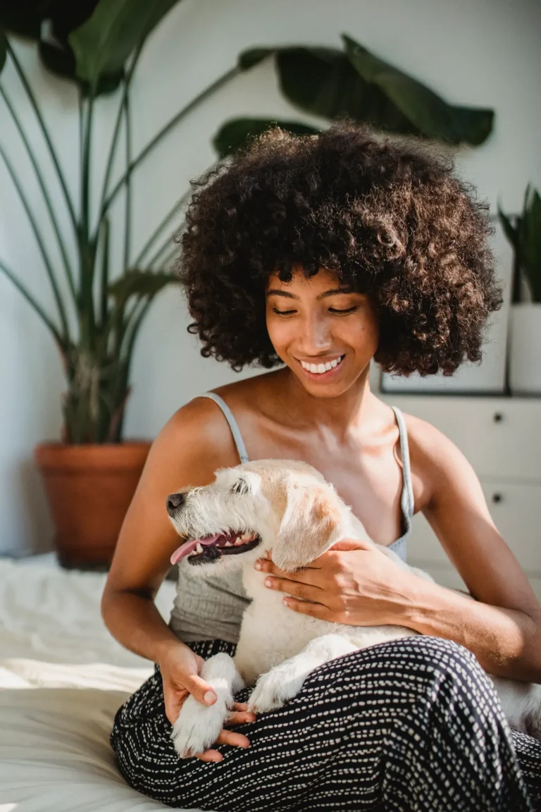 Woman with her dog at home — best dog breeds for single women