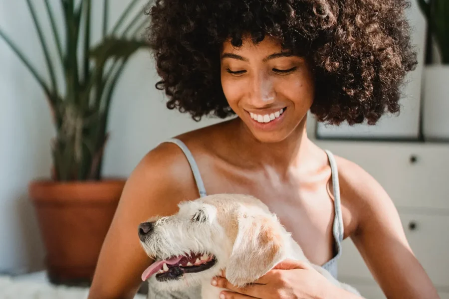Best Dog Breeds for Single Women in 2026: Top Picks for Safety, Companionship & Every Lifestyle 20 Woman with her dog at home — best dog breeds for single women